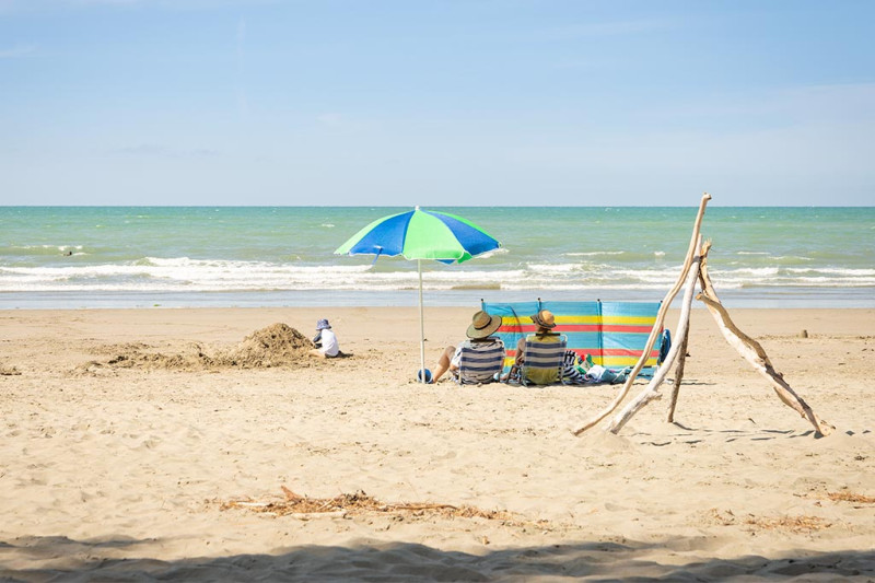 Rabbit Island Beach Beach Visitors & Umbrella, 